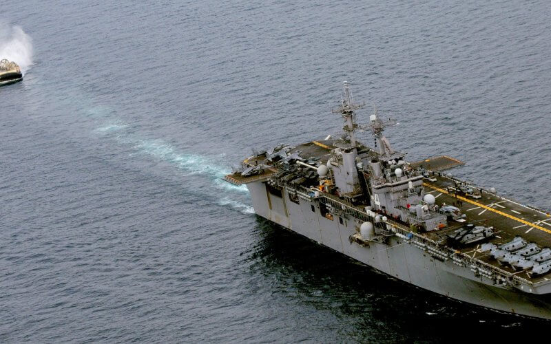 A landing craft approaches the amphibious assault ship USS Boxer for docking. U.S. Navy photo