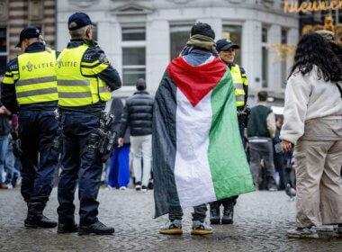 Police officers stand by as people gather during a demonstration in Amsterdam on November 9, 2024. AFP