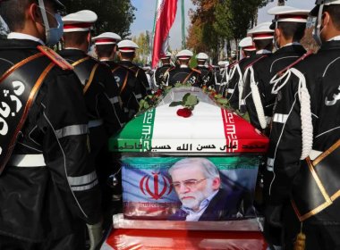 Military personnel stand near the coffin of Mohsen Fakhrizadeh during his funeral in Tehran. AP