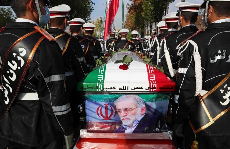 Military personnel stand near the coffin of Mohsen Fakhrizadeh during his funeral in Tehran. AP