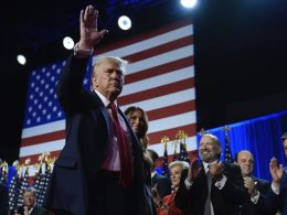 Republican presidential nominee former President Donald Trump and former first lady Melania Trump walk on stage at an election night watch party at the Palm Beach Convention Center. AP