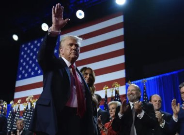 Republican presidential nominee former President Donald Trump and former first lady Melania Trump walk on stage at an election night watch party at the Palm Beach Convention Center. AP