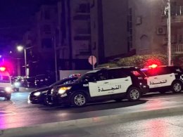 Police vehicles are stationed on a street near the Israeli embassy in Amman, Jordan, on 24 November 2024. Reuters