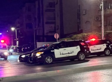 Police vehicles are stationed on a street near the Israeli embassy in Amman, Jordan, on 24 November 2024. Reuters