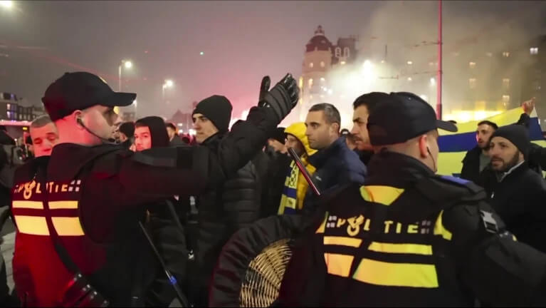 Police responding to attacks on Maccabi Tel Aviv supporters in Amsterdam. AP