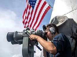 Seaman Caleb Alba conducts watch stander duties aboard the guided-missile destroyer USS Halsey in the South China Sea. U.S. Navy