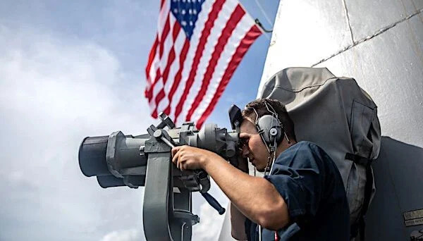 Seaman Caleb Alba conducts watch stander duties aboard the guided-missile destroyer USS Halsey in the South China Sea. U.S. Navy