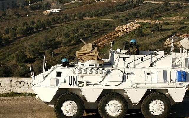 A UNIFIL peacekeeper drives an armored vehicle in Lebanon. AFP