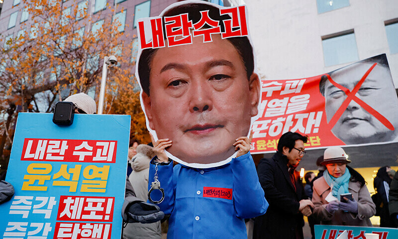 A protestor at a rally calling for the impeachment of South Korean President Yoon Suk Yeol. Reuters