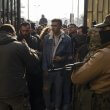 Former Syrian soldiers wait to apply for amnesty consideration in Damascus. AP