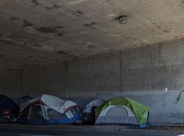 A homeless encampment under an underpass in 2018. wikimedia.org