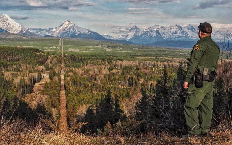 A Border Patrol agent standing watch at the Montana-Canada border in the CBP Spokane Sector. The Spokane Sector covers the U.S.-Canada border along the northwestern section of Montana, part of Idaho, and the eastern part of Washington. U.S. Customs and Border Protection