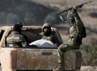 Anti-government insurgents traveling between Aleppo and Hama. AFP