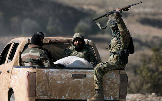 Anti-government insurgents traveling between Aleppo and Hama. AFP