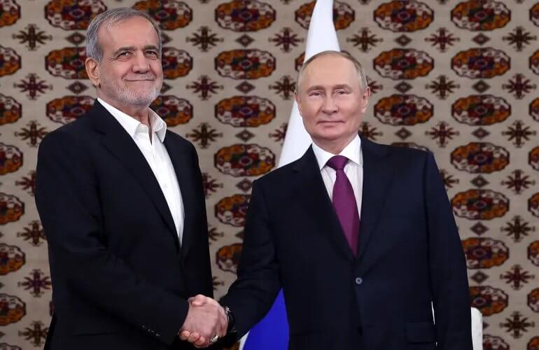 Russian President Vladimir Putin and Islamic Republic President Masoud Pezeshkian meet on the sidelines of a regional forum in Ashgabat, Turkmenistan. Sputnik