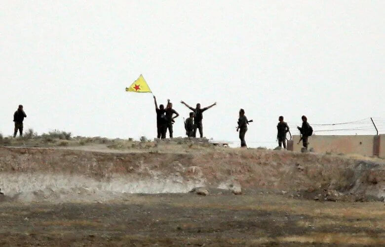 Kurdish militia fighters near Tal Abyad. AP