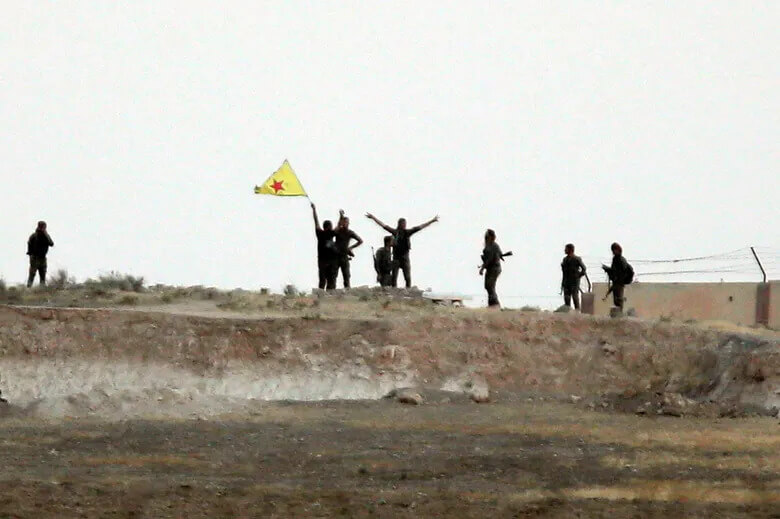 Kurdish militia fighters near Tal Abyad. AP