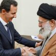 Syrian President Bashar al-Assad, left, shakes hands with the Islamic Republic's Supreme Leader Ali Khamenei. SANA