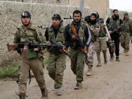 Syrian rebels march in al-Bab. Reuters