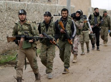 Syrian rebels march in al-Bab. Reuters