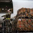 An airman with the 436th Aerial Port Squadron loads cargo during a Ukraine security assistance mission at Dover AFB. U.S. Air Force