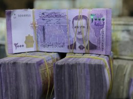 Syrian pounds are pictured inside an exchange currency shop in Azaz, Syria. Reuters