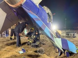 Investigators poring over the wreckage of the Azerbaijan Airlines plane. Kazakhstan Emergencies Ministry