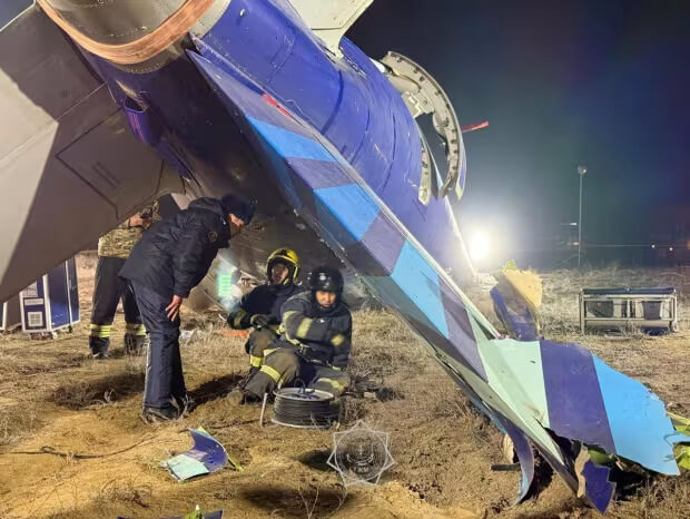 Investigators poring over the wreckage of the Azerbaijan Airlines plane. Kazakhstan Emergencies Ministry