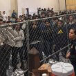 Men stand in a US Immigration and Border Enforcement detention center in McAllen, Texas. AP