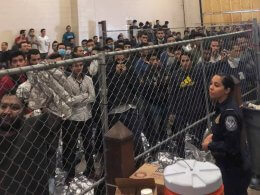 Men stand in a US Immigration and Border Enforcement detention center in McAllen, Texas. AP