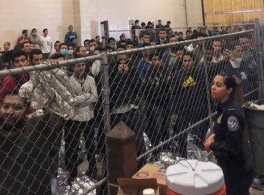 Men stand in a US Immigration and Border Enforcement detention center in McAllen, Texas. AP