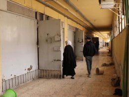 Syrians walking through the halls of the Sednaya prison. news.sky.com