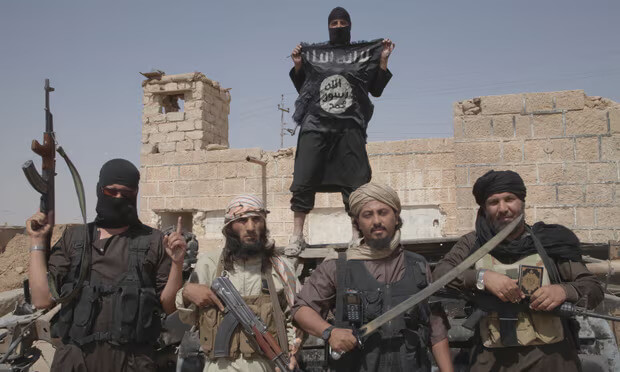 ISIS fighters near the border between Syria and Iraq. Medyan Dairieh/Corbis